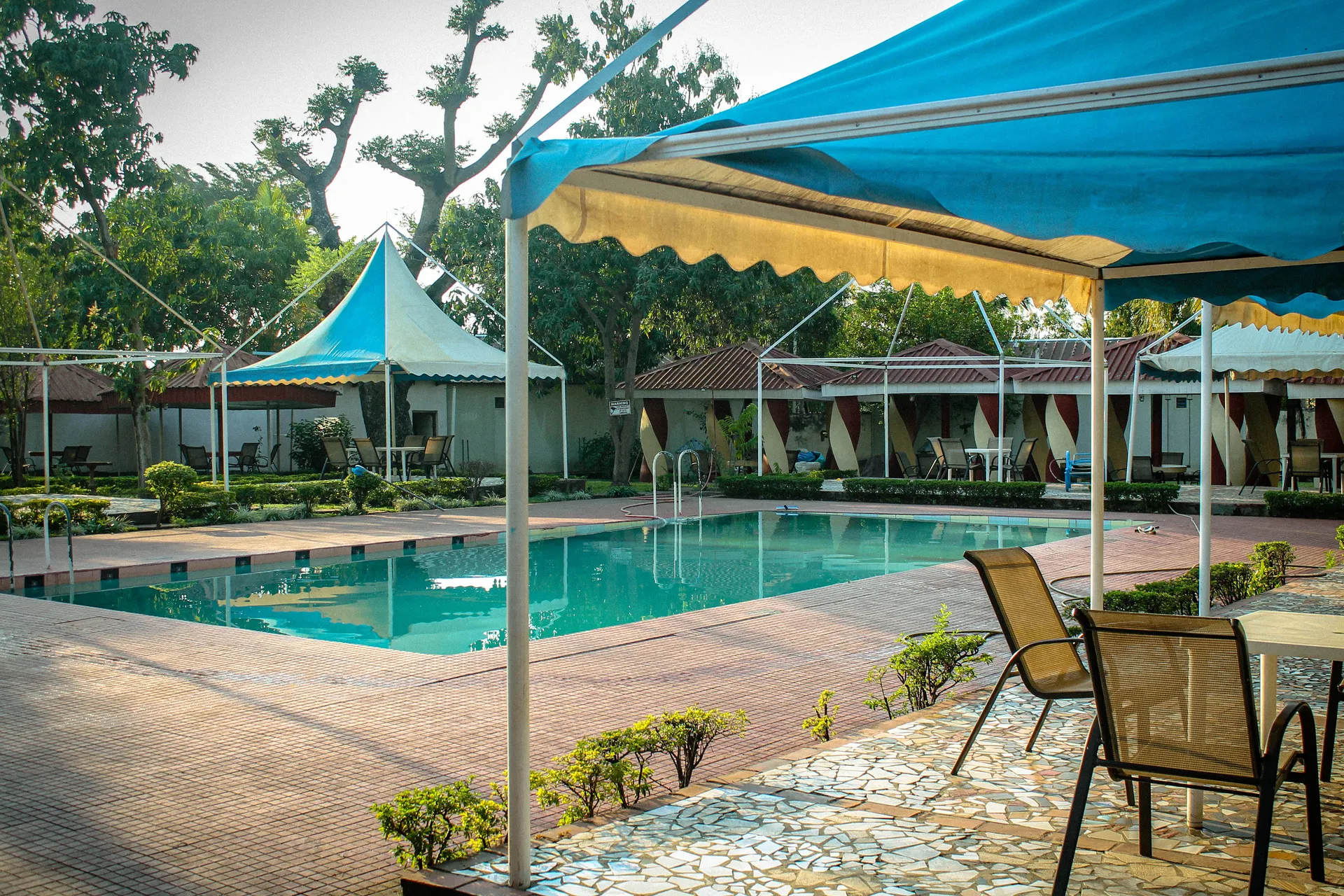 view of pool with slide and seating area